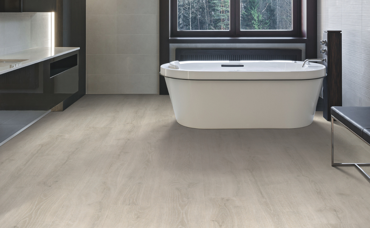 Laminate flooring in a bathroom with a bathtub
